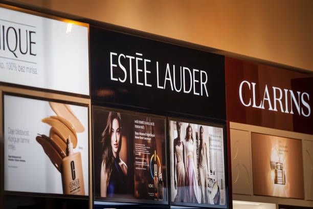 Estee Lauder logo on a shelf of products of the brand. Estee Lauder is an american cosmetics and skincare brand on the luxury market. stock photo