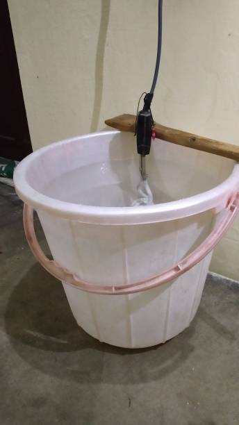 istock Water Heating from Immersion Rod in bucket. 1293244283