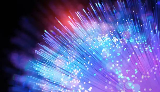 fiber optics network cable for ultra fast internet communications, thin light threads that move information at high speed.