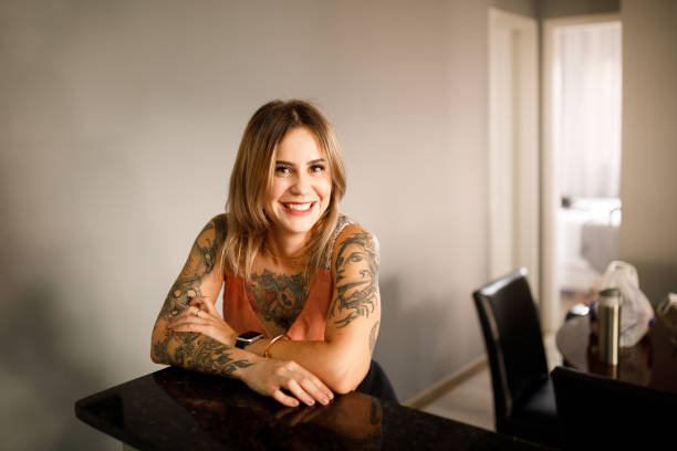 istock Smiling woman leaning on the countertop 1293247187