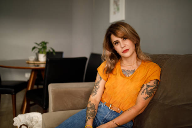 istock portrait woman sitting and resting on sofa 1293247203