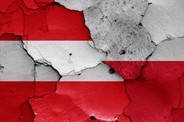 flags of Austria and Poland painted on cracked wall