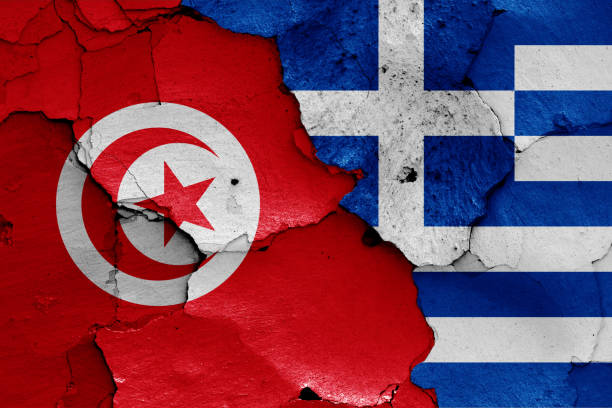 istock flags of Tunisia and Greece painted on cracked wall 1293251909