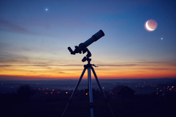 istock Silhouette of a astronomy telescope with twilight sky. 1293264339
