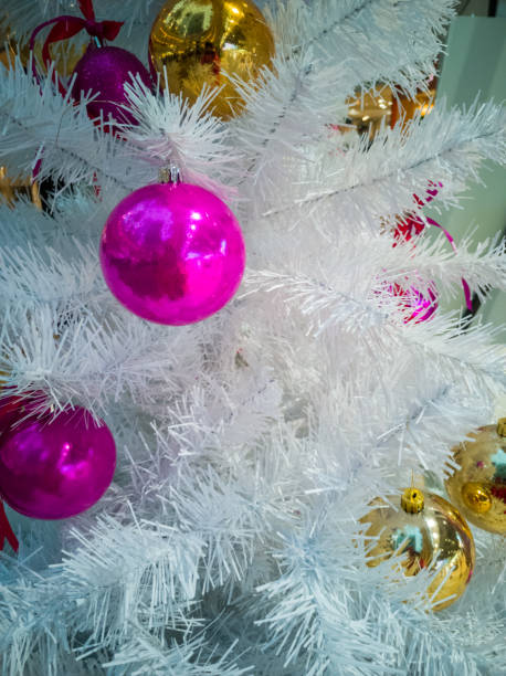 istock Christmas toys on a white artificial Christmas tree close up 1293265463