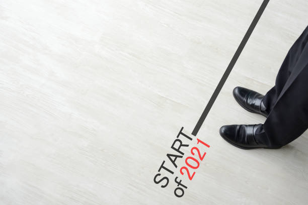 istock Business man standing on starting line of 2021 1293266076