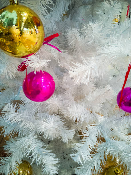 istock Christmas toys on a white artificial Christmas tree close up 1293266230