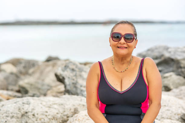 istock Senior Hispanic woman on Caribbean beach 1293268235