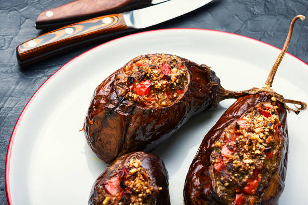 istock Grilled eggplant stuffed with vegetables 1293273253