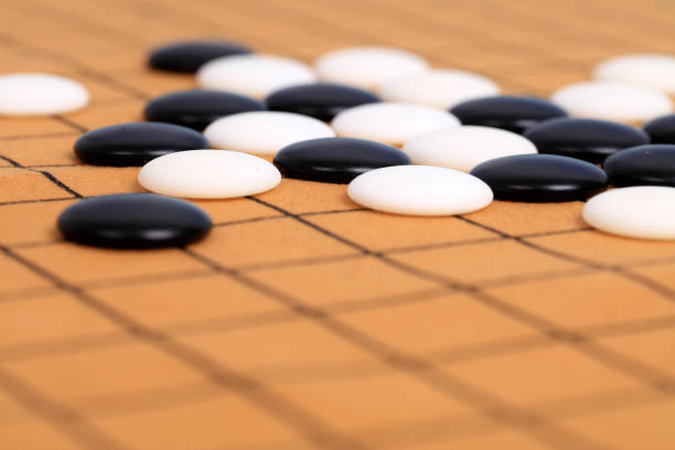 istock chinese game go,  Gobang and go game board 1293273450