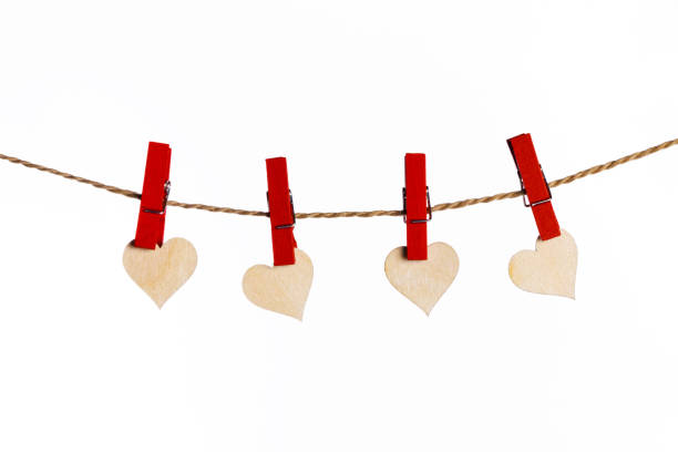 istock Red hearts with clothes pegs on rope 1293274104