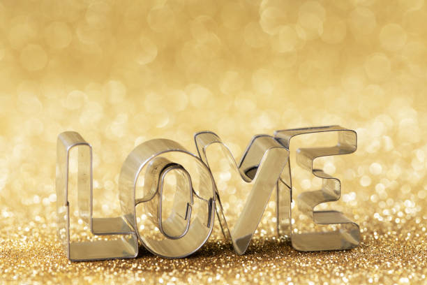 istock Word LOVE on golden background 1293274109