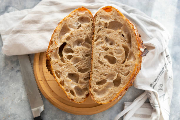 istock Sourdough bread slices, on a cutting board. Organic homemade bread. 1293274367