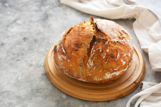 istock Sourdough Bread isolated on a cutting board. Organic homemade bread. 1293274428
