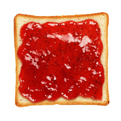Slice of toasted bread with red raspberry jam isolated on white background.