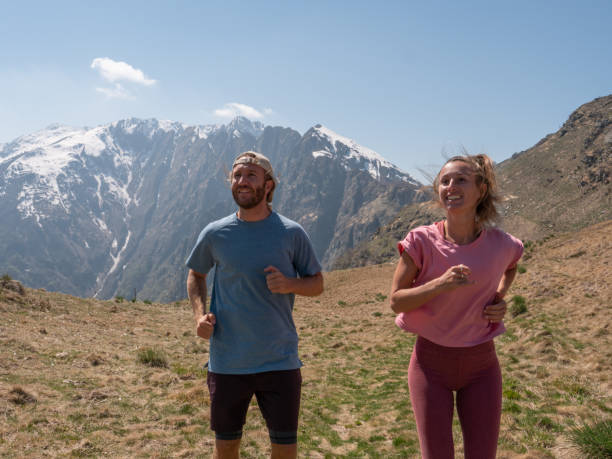 istock Sportive young couple jogging outdoors, trail running 1293275525