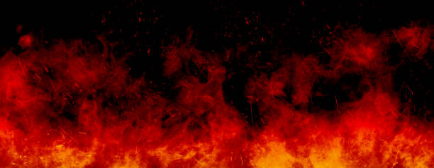 istock Orange fire or flames with sparkles and smoke in black background. 1293280038
