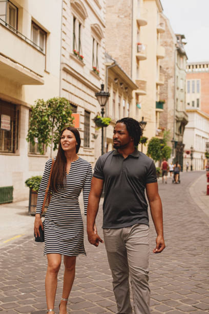 istock Tourist couple exploring the city 1293280039