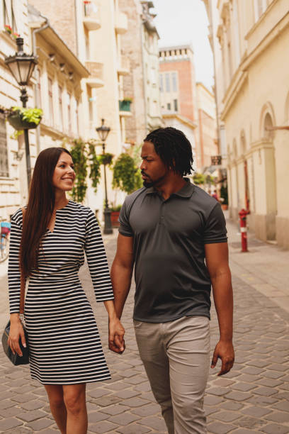 istock Couple having a discussion during a walk in the city 1293280094