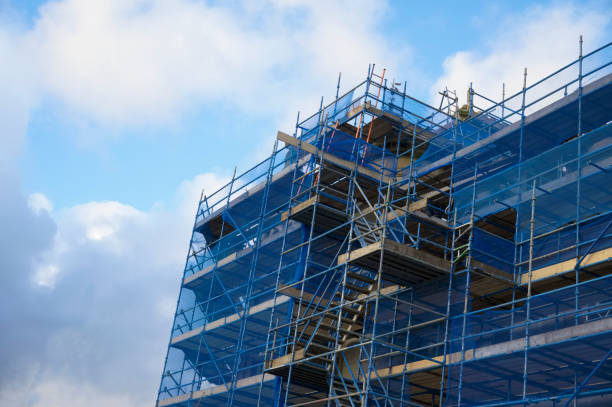 istock Scaffolding surrounding house renovation for safe access to refurbishment height 1293282915