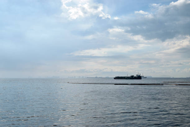 istock Offshore construction vessel anchored far from sea shore 1293283039