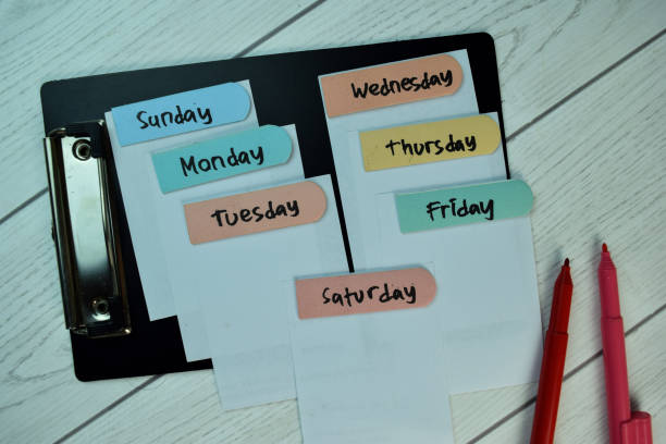 istock The Day of the week write on sticky notes isolated on Wooden Table. 1293284709