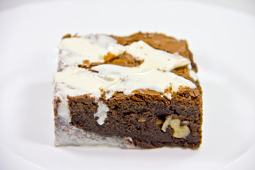 Brownie with icing and chocolate