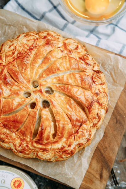 istock Puff pastry chicken pie with different fillings. Baking on a wooden background, close-up. 1293287373