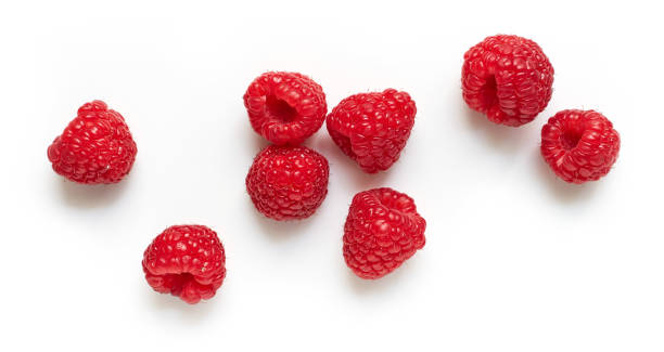 istock fresh ripe raspberries isolated on white background, top view 1293291211