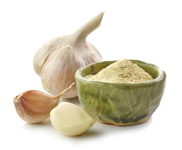 istock bowl of garlic powder isolated on white background 1293292449