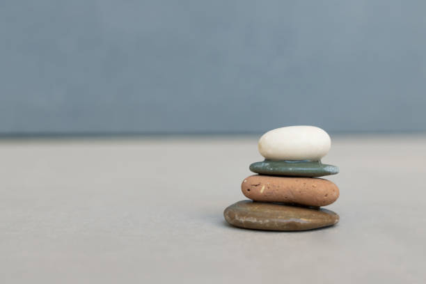 istock Stack of zen-like pebble stones on the floor. 1293292603