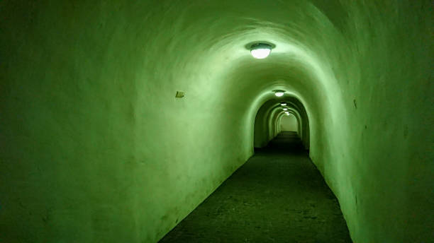 istock Mystical and mysterious dungeon corridor with green lighting 1293300604