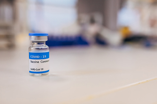 COVID-19 vaccine vial at the pharamaceutical laboratory