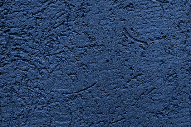 istock The wall is made of plaster. Rough surface. Solid color abstract background. 1293301840