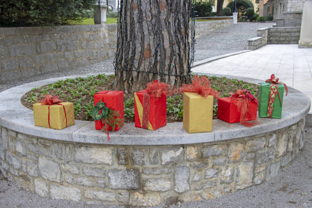 istock Christmas decorations with Christmas gift boxes in a city park 1293304143
