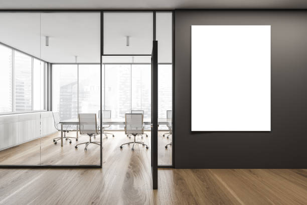 istock Mockup blank canvas on dark wall in corridor of business centre 1293304228