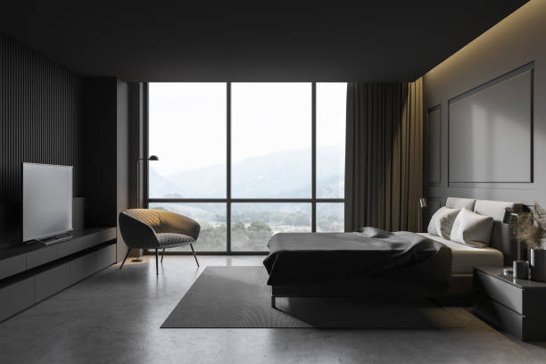 istock Gray master bedroom with armchair 1293305325