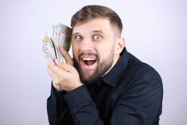 istock businessman man with dollars in his hands 1293306331