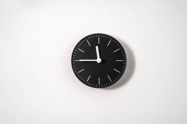 istock close up of an office clock on white background with clipping path 1293307856