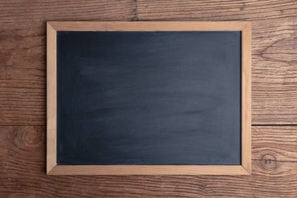 A blackboard on an old wooden board stock photo