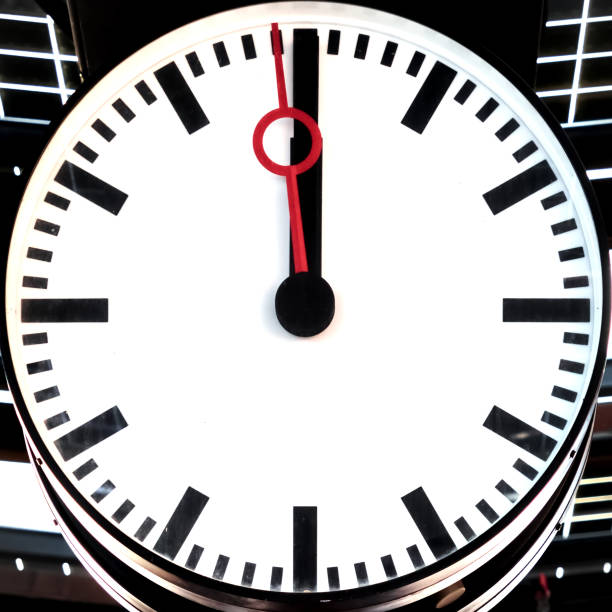 Uelzen, Germany, December 18., 2020: Clock shows one minute to twelve, concept for little time, hurry, emergency