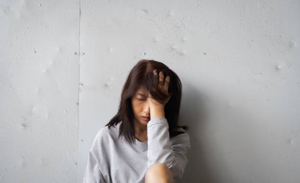 istock Unhappy woman put hand touch her face,with upset and sad feeling 1293310173