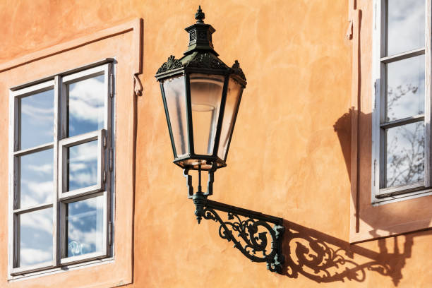 old street lamp on the yellow wall