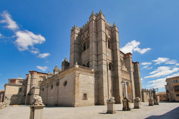 AVILA, SPAIN - DECEMBER 19, 2020: Cathedral of the city of Avila (World Heritage Site by UNESCO) illuminated at night. Castilla y Leon. Spain