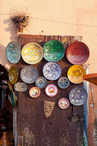 Moroccan plates decor at wall outside of store in Medina of Marrakech