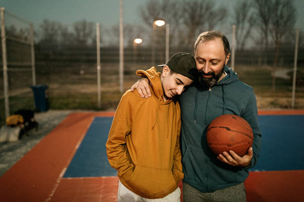 istock Father and son after the basketball match 1293320178
