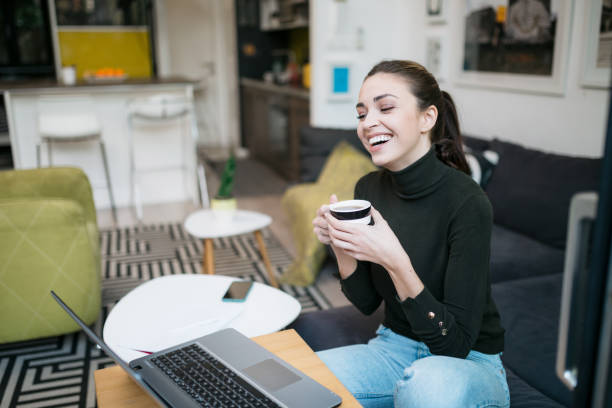 istock Beautiful happy Caucasian woman working from home using a laptop 1293320609