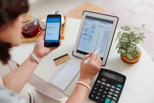 Photo of Woman checking brokerage account