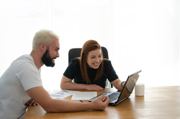istock Man and woman at the office working together. 1293325472