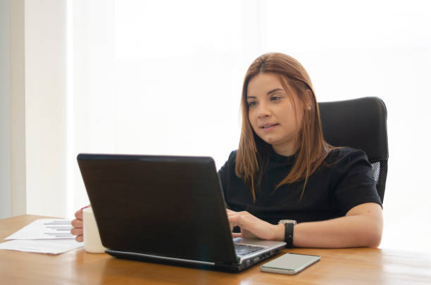 istock Woman at the office working. 1293325631